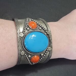 Silver tone blue and orange bangle cuff bracelet 6.75"